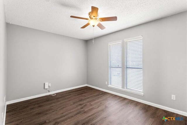 12103 Wycliff Ln, Austin, TX 78727 - spare room featuring ceiling fan, dark wood-style flooring, and a textured ceiling