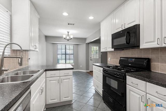 12103 Wycliff Ln, Austin, TX 78727 - kitchen featuring black appliances, white cabinets, light tile patterned floors, and recessed lighting