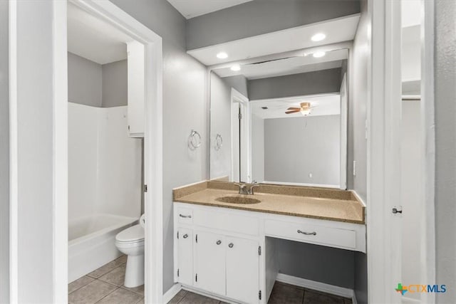 12103 Wycliff Ln, Austin, TX 78727 - full bath with vanity, tile patterned flooring, washtub / shower combination, and ceiling fan