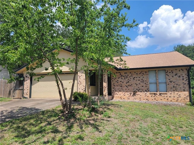 12103 Wycliff Ln, Austin, TX 78727 - single story home with brick siding, a garage, and concrete driveway