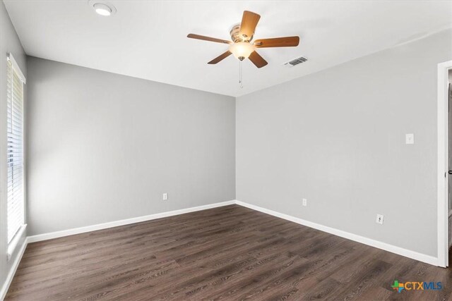12103 Wycliff Ln, Austin, TX 78727 - unfurnished room with a ceiling fan and dark wood finished floors