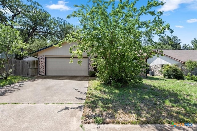 12103 Wycliff Ln, Austin, TX 78727 - view of front of property featuring concrete driveway, brick siding, and a garage