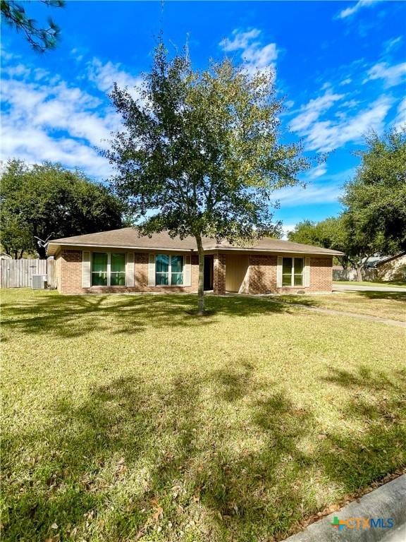 ranch-style house with a front yard