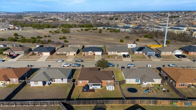 birds eye view of property with a residential view