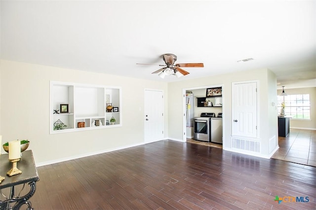 4113 Fm 1670, Belton, TX 76513 - unfurnished living room with washing machine and dryer, a ceiling fan, and dark wood-style flooring