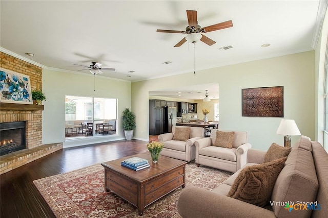4113 Fm 1670, Belton, TX 76513 - living area featuring ceiling fan, plenty of natural light, dark wood-style flooring, a brick fireplace, and ornamental molding