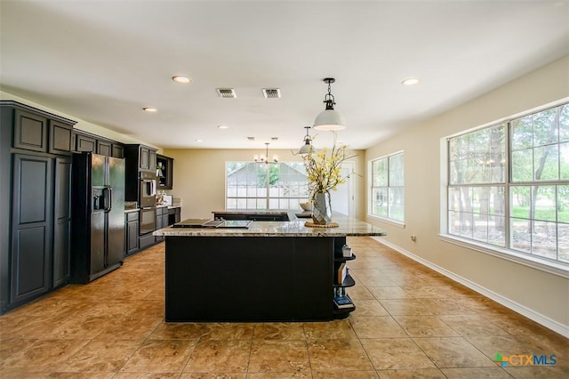 4113 Fm 1670, Belton, TX 76513 - kitchen with black fridge with ice dispenser, healthy amount of natural light, a chandelier, a kitchen island, and recessed lighting
