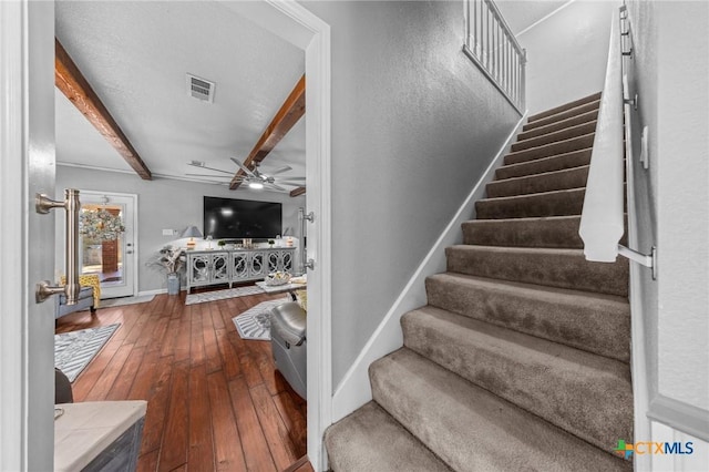 2203 Antelope Trl, Harker Heights, TX 76548 - stairs with a ceiling fan, beam ceiling, and hardwood / wood-style flooring