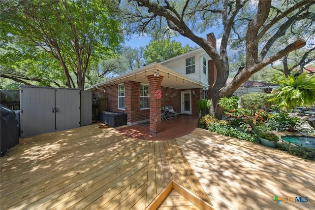 2203 Antelope Trl, Harker Heights, TX 76548 - view of front facade featuring brick siding, a wooden deck, and a shed