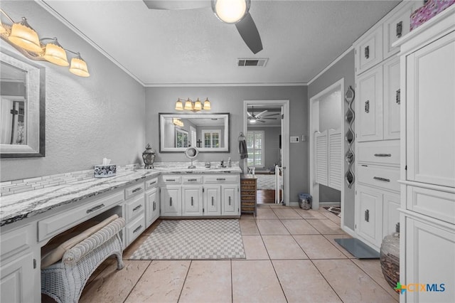 2203 Antelope Trl, Harker Heights, TX 76548 - full bathroom with a ceiling fan, crown molding, vanity, a textured ceiling, and tile patterned floors