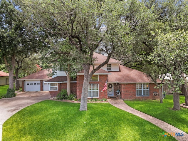 2203 Antelope Trl, Harker Heights, TX 76548 - view of front of home with a garage, roof with shingles, brick siding, and concrete driveway