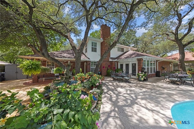 2203 Antelope Trl, Harker Heights, TX 76548 - rear view of house featuring brick siding, a patio, and outdoor dining space