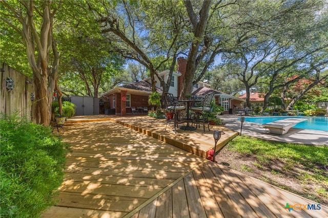 2203 Antelope Trl, Harker Heights, TX 76548 - exterior space with a wooden deck, a storage unit, and an outdoor pool