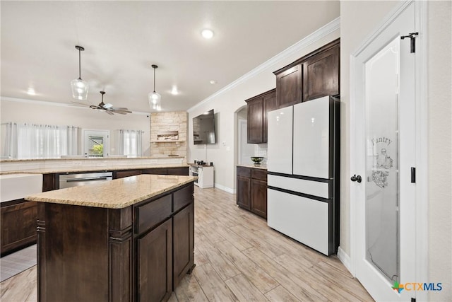 2416 Macdougal St, Nolanville, TX 76559 - kitchen with freestanding refrigerator, dark brown cabinets, ornamental molding, dishwasher, and a kitchen island