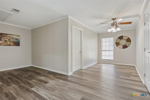 15 Willow Ct, Belton, TX 76513 - empty room featuring a ceiling fan, wood finished floors, a textured ceiling, crown molding, and baseboards