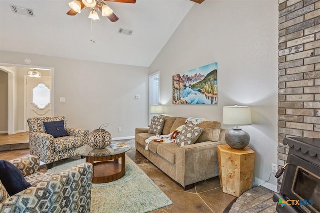 15 Willow Ct, Belton, TX 76513 - living room with a ceiling fan, a wood stove, high vaulted ceiling, and baseboards