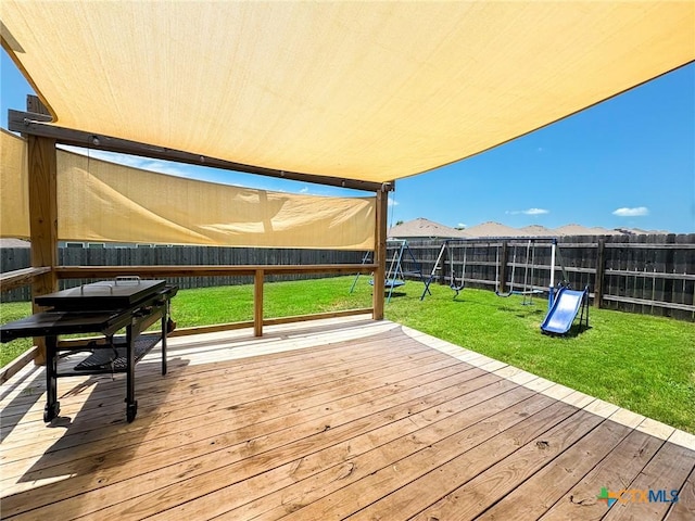 2321 Vicksburg Ln, Temple, TX 76504 - deck with a playground and a fenced backyard