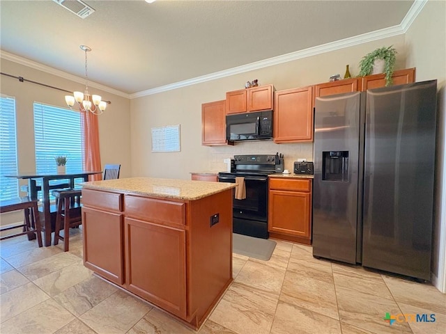2321 Vicksburg Ln, Temple, TX 76504 - kitchen with black appliances, ornamental molding, a kitchen island, a chandelier, and hanging light fixtures