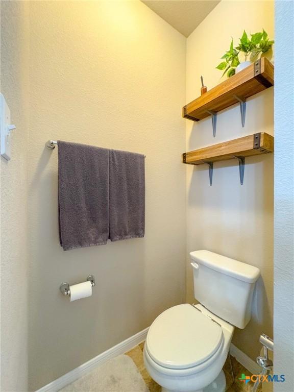 2321 Vicksburg Ln, Temple, TX 76504 - bathroom featuring toilet and tile patterned floors
