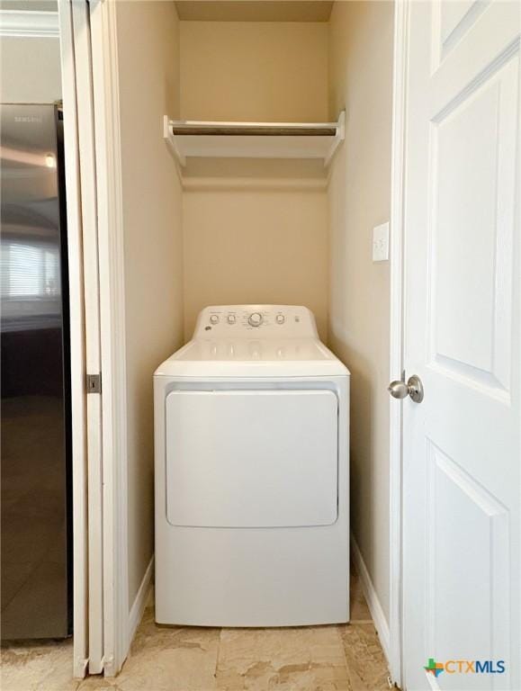 2321 Vicksburg Ln, Temple, TX 76504 - laundry area featuring washer / clothes dryer and baseboards