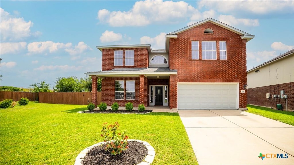 5414 Birmingham Cir, Killeen, TX 76542 - traditional home featuring brick siding, an attached garage, and concrete driveway
