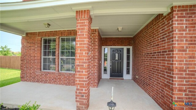 5414 Birmingham Cir, Killeen, TX 76542 - view of exterior entry with brick siding and a porch
