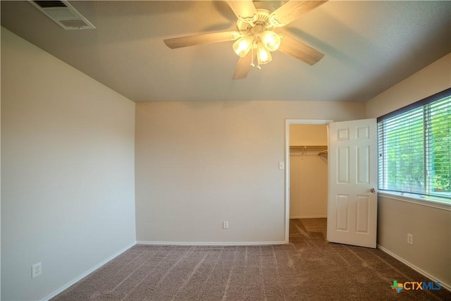 5414 Birmingham Cir, Killeen, TX 76542 - unfurnished bedroom with carpet, a spacious closet, baseboards, a closet, and ceiling fan