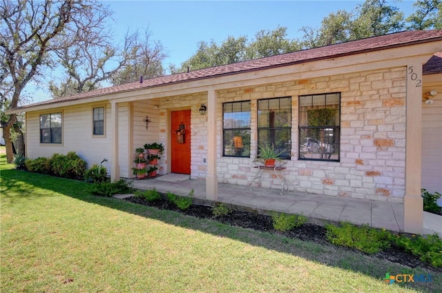 ranch-style home with a front lawn