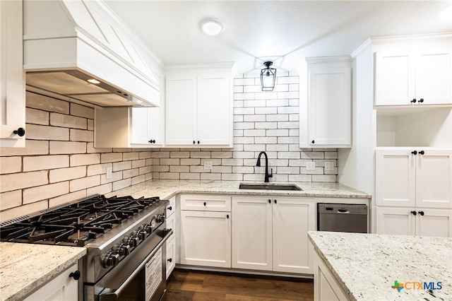 kitchen featuring sink, white cabinetry, stainless steel appliances, and custom range hood