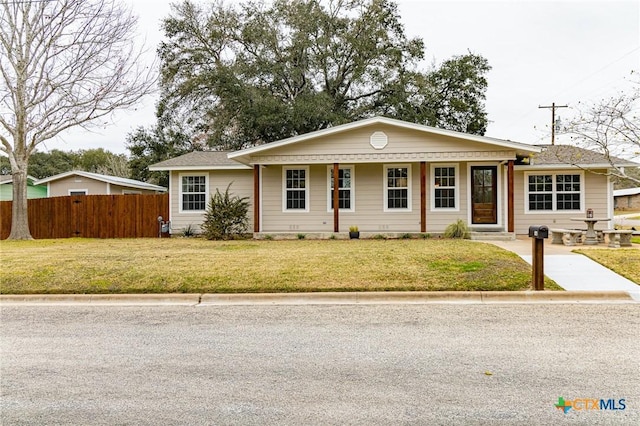 ranch-style home with a front lawn