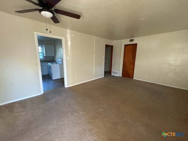 interior space featuring ceiling fan and dark carpet