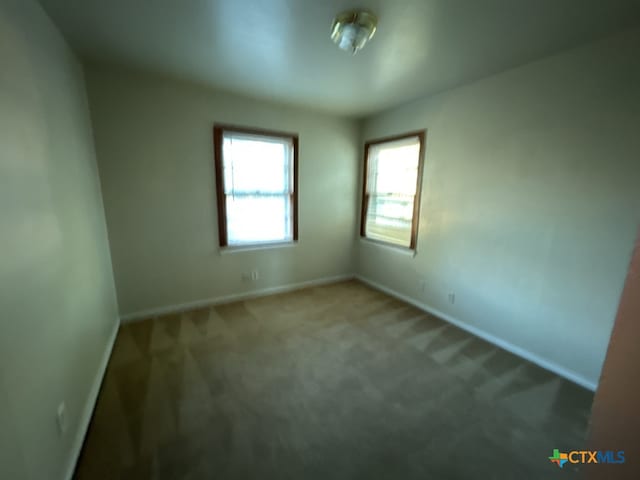 view of carpeted spare room