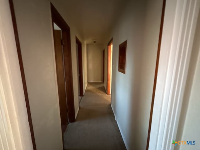 hallway featuring light carpet