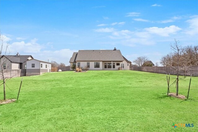 4453 Cedar Creek Rd, Temple, TX 76504 - back of house with a yard and a fenced backyard