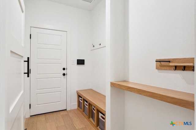 mudroom with light wood-style floors