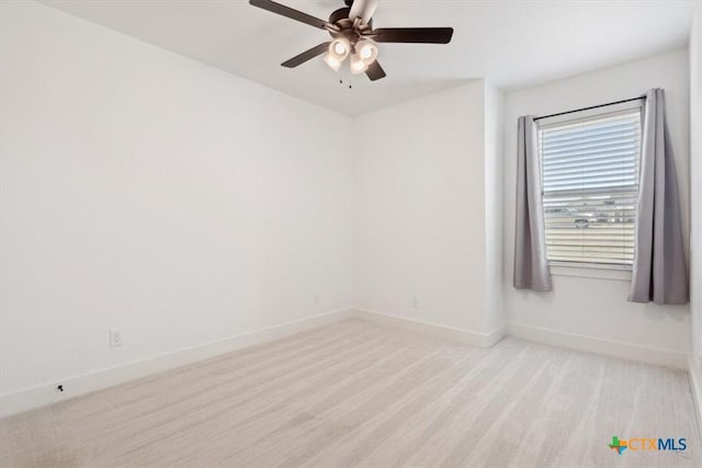 empty room with baseboards and ceiling fan