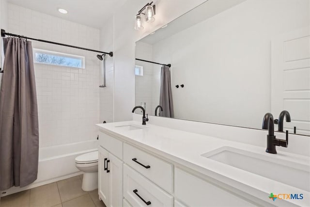 full bathroom with a sink, toilet, shower / bath combo, and tile patterned flooring