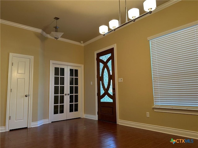 foyer entrance featuring ornamental molding, french doors, dark wood finished floors, and baseboards