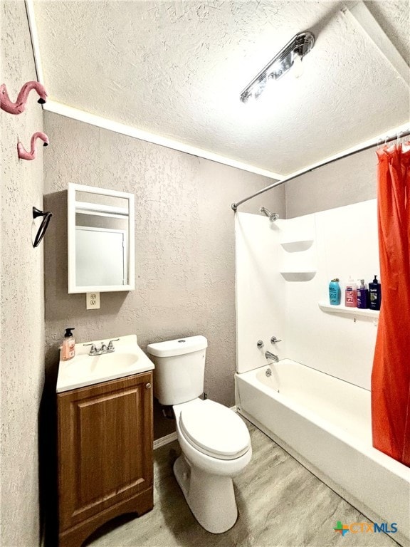 full bathroom with vanity, toilet, a textured ceiling, hardwood / wood-style flooring, and shower / tub combo with curtain