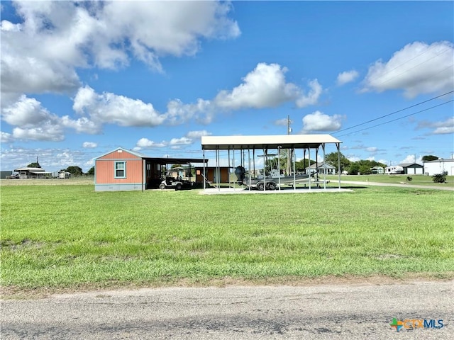 101 N 13th St, Seadrift, TX 77983 - view of building exterior featuring a carport