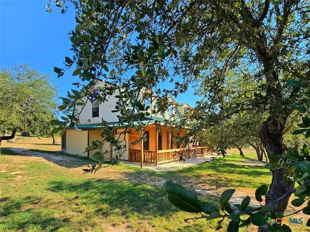 view of yard with a wooden deck