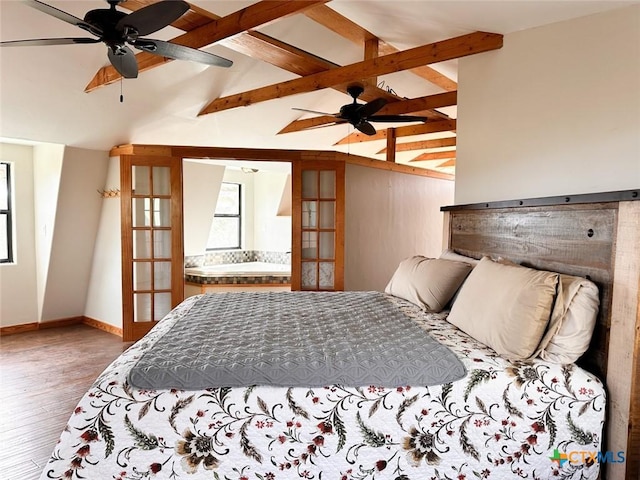 bedroom with vaulted ceiling with beams, hardwood / wood-style flooring, and french doors