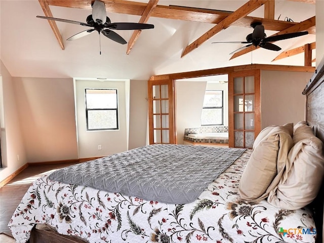 bedroom featuring lofted ceiling with beams and hardwood / wood-style flooring