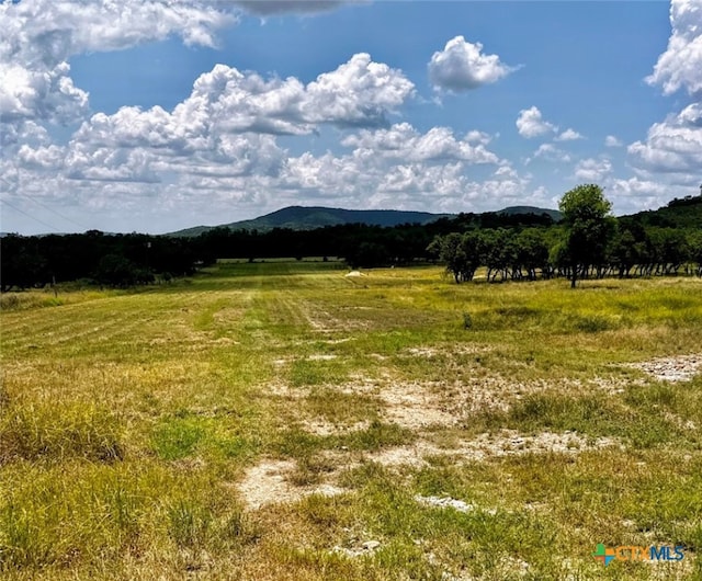 view of mountain feature with a rural view