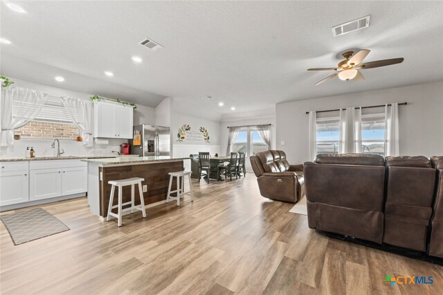 31682 Nimbus Dr, Bulverde, TX 78163 - living area featuring a ceiling fan, light wood-type flooring, and recessed lighting