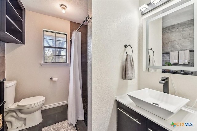 bathroom featuring vanity, toilet, tile patterned flooring, and a shower with shower curtain