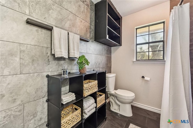 bathroom with tile patterned floors and toilet