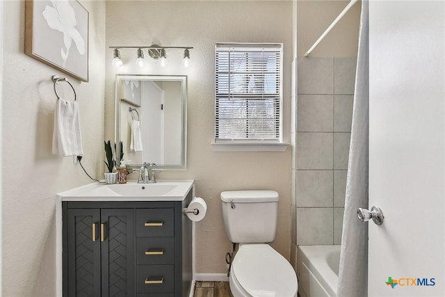 full bathroom featuring vanity, toilet, and shower / bath combo with shower curtain