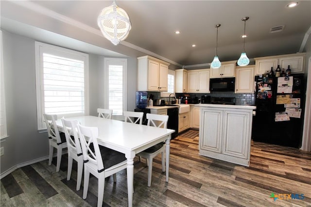 2711 Curtis Dr, Copperas Cove, TX 76522 - kitchen with black appliances, a kitchen island, decorative backsplash, dark wood-style floors, and recessed lighting