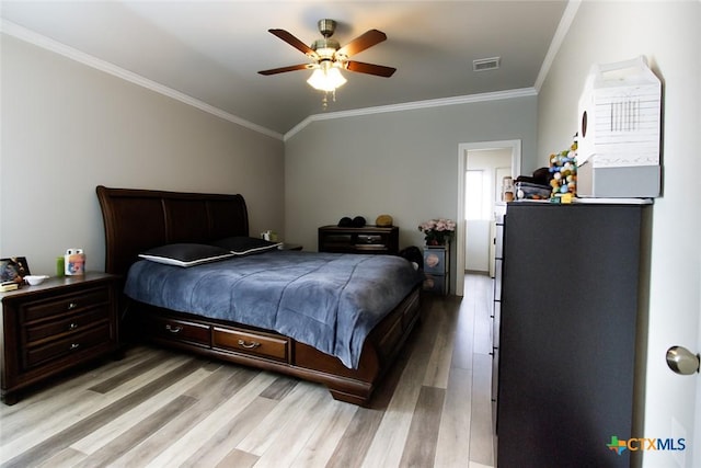 2711 Curtis Dr, Copperas Cove, TX 76522 - bedroom with light wood finished floors, crown molding, a ceiling fan, and lofted ceiling